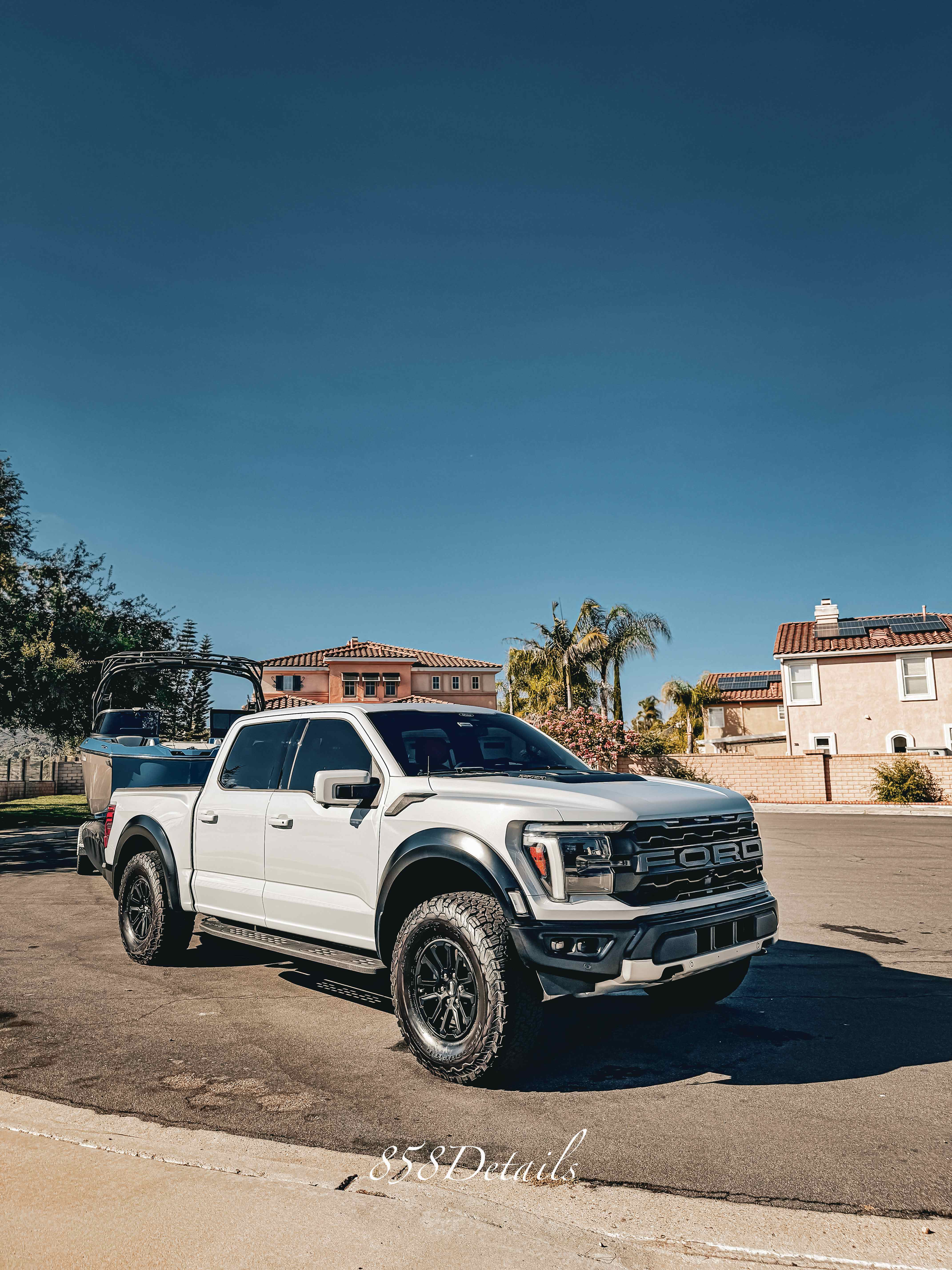 White Ford Raptor detailed in San Diego driveway